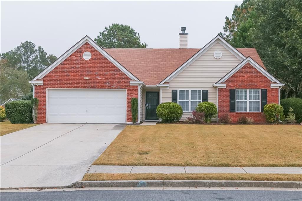 a front view of a house with yard