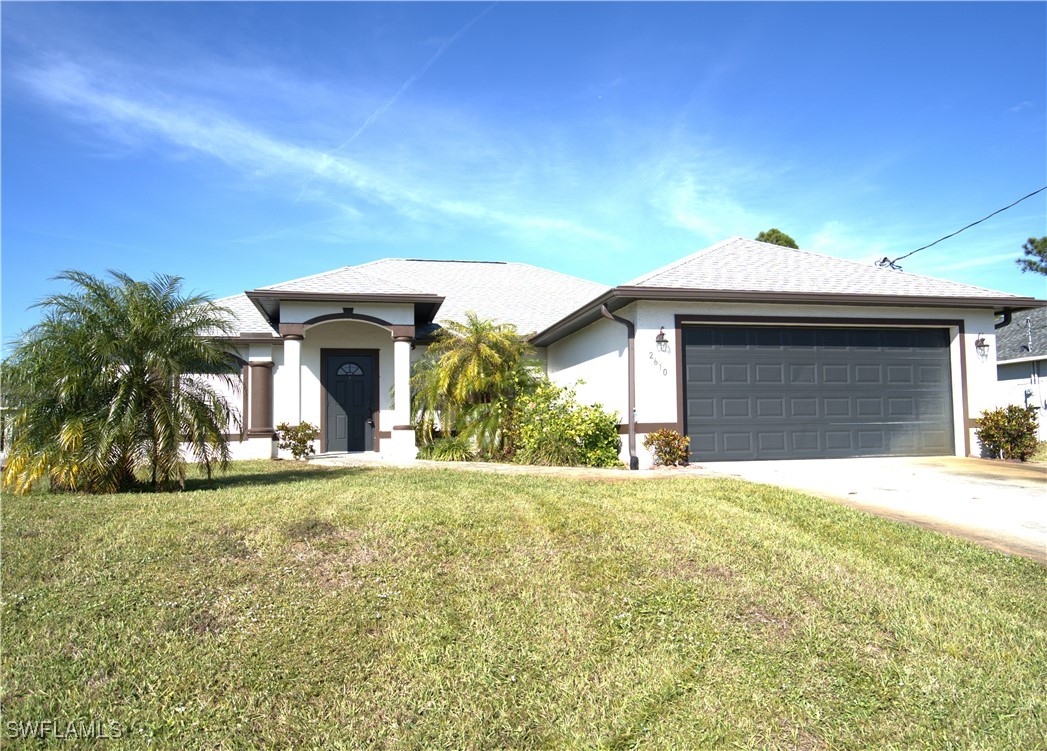 a front view of a house with a yard