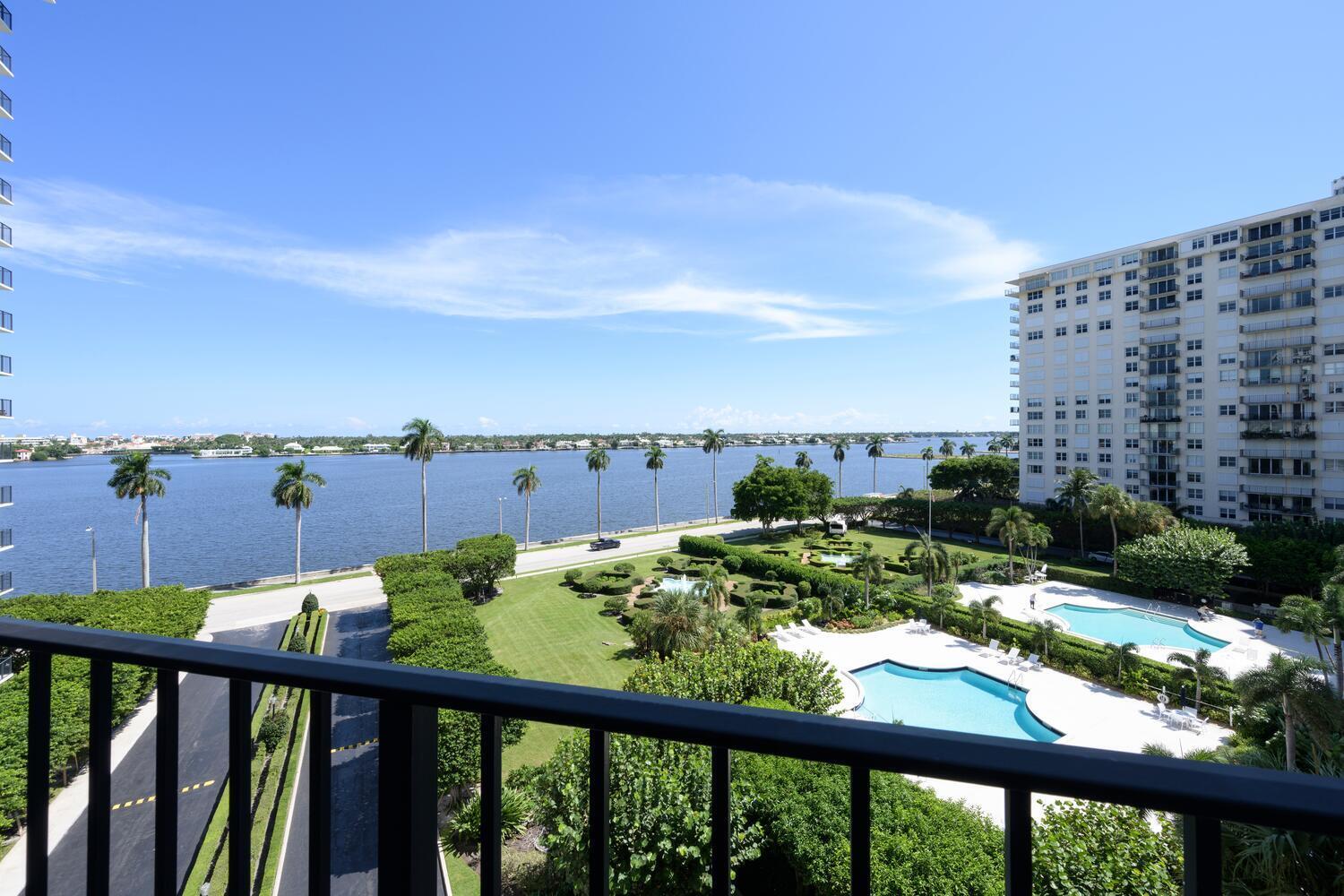 a view of a balcony with an outdoor seating