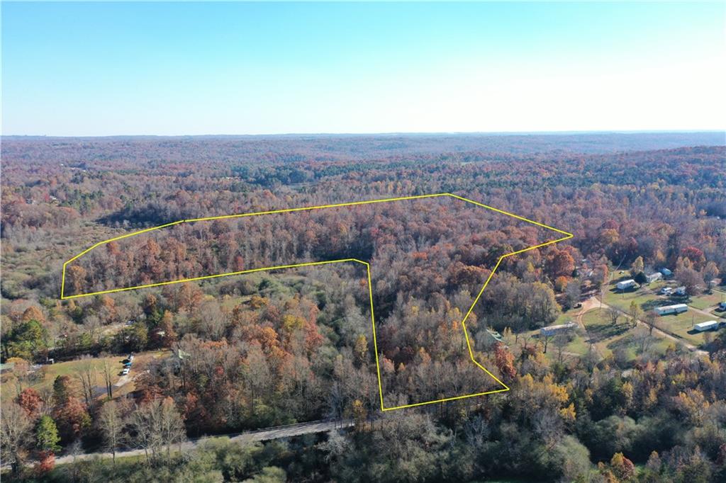 an aerial view of house with yard