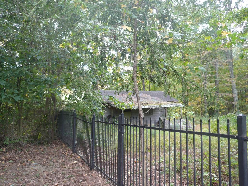 a view of a wrought iron fences in front of house