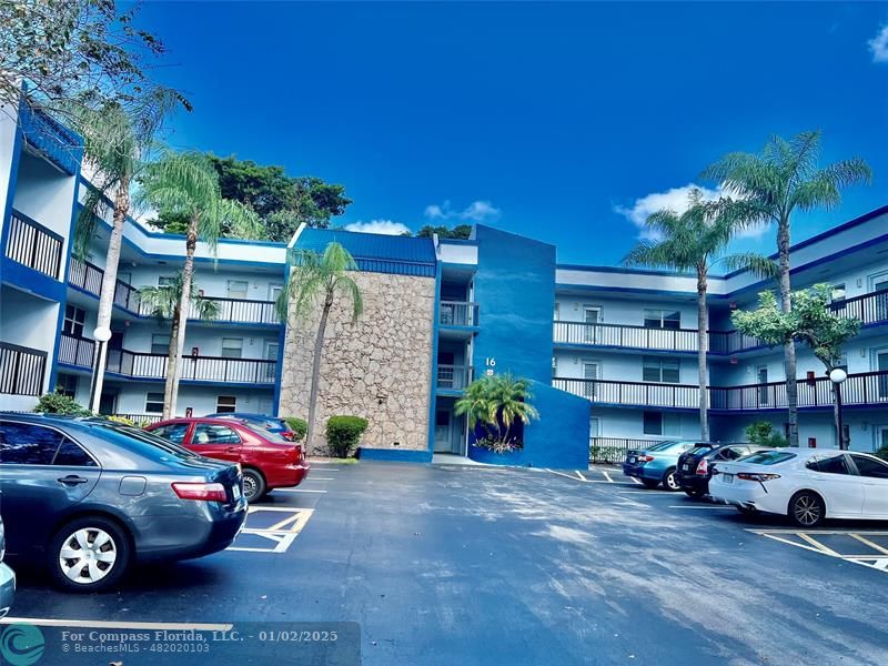 a view of a cars parked in front of a building