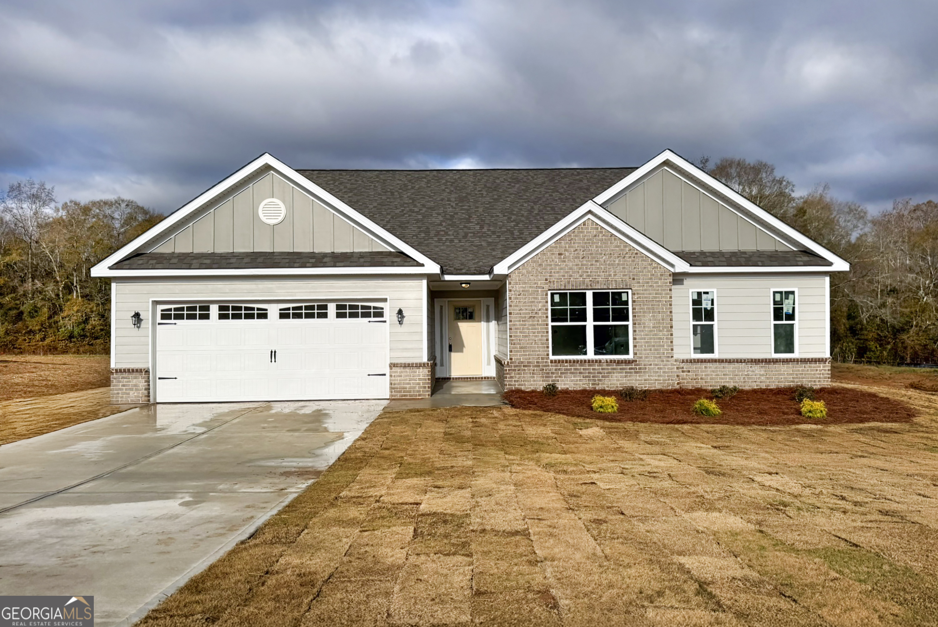 a front view of a house with a yard