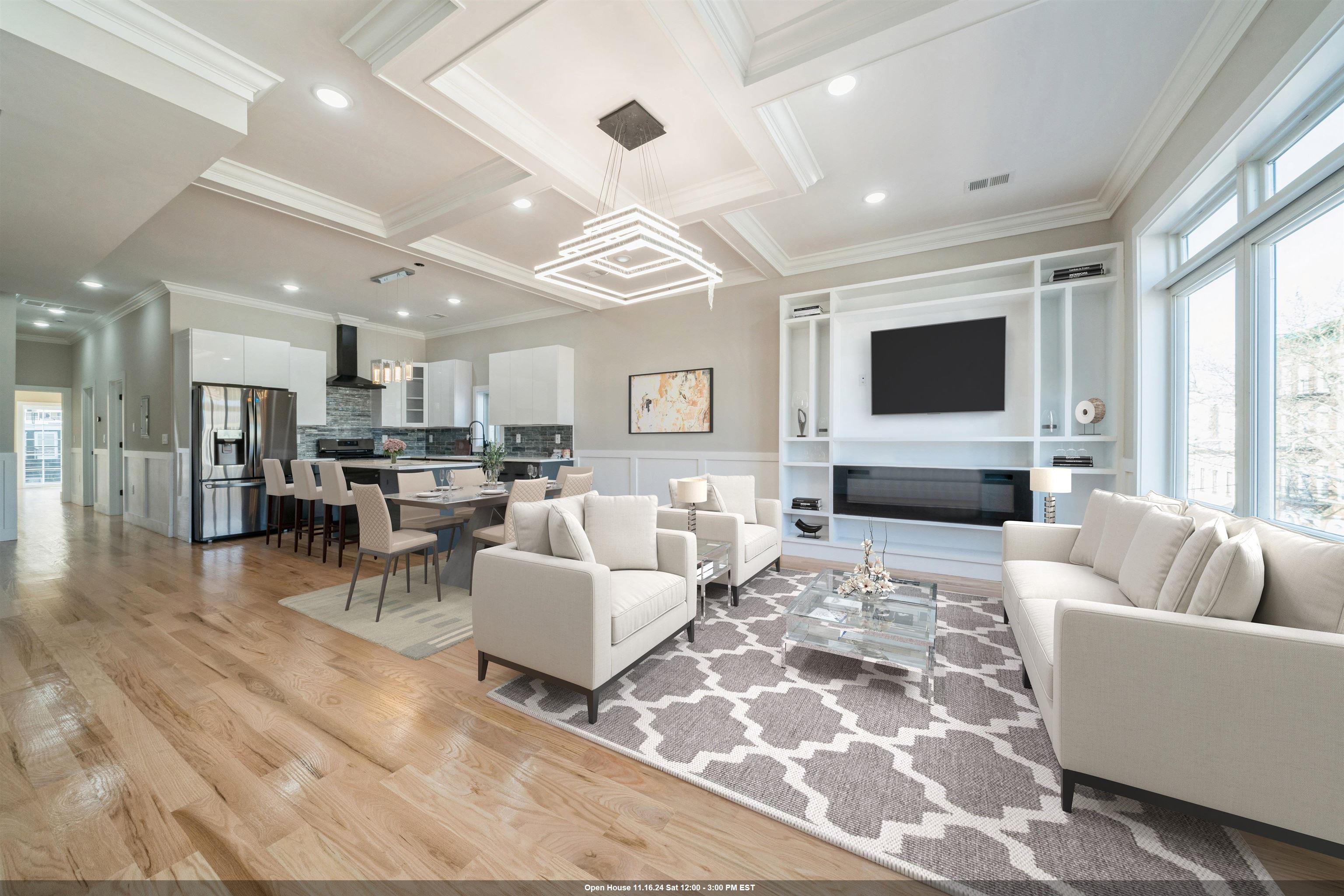 a living room with furniture wooden floor and a flat screen tv