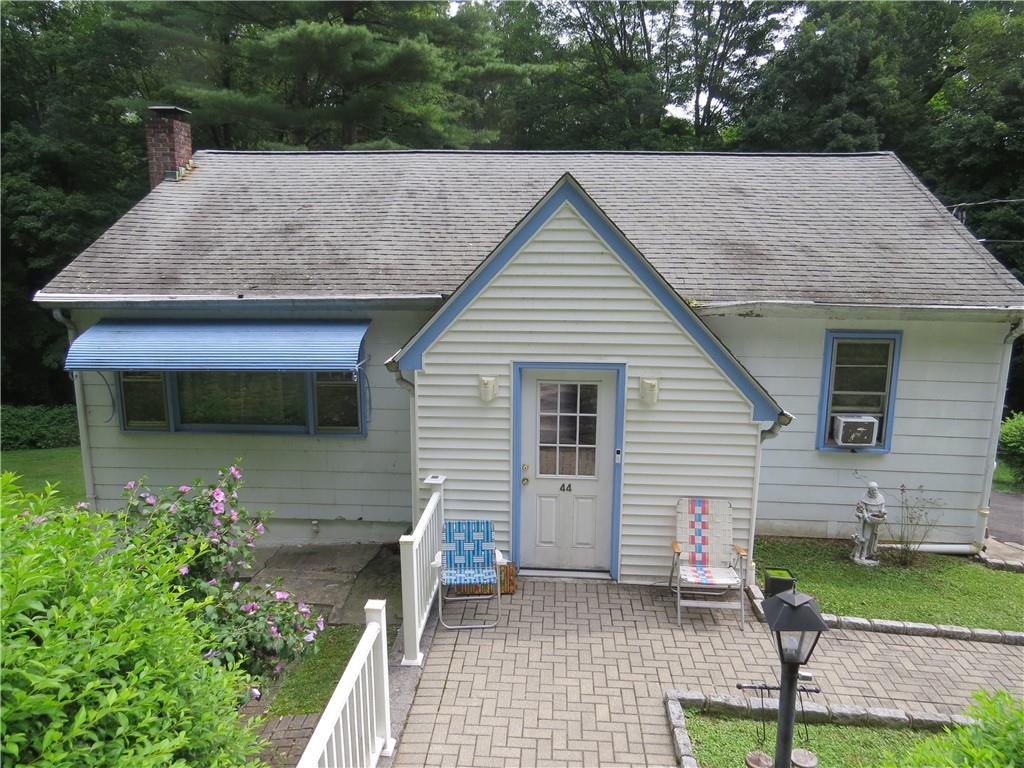 Bungalow-style house featuring a patio and cooling unit