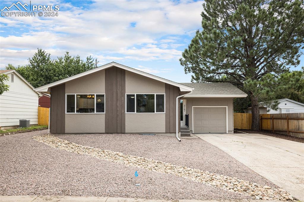 Ranch-style home featuring a garage