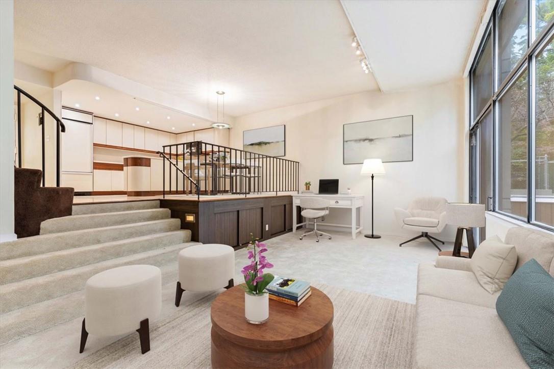 Living room featuring light colored carpet