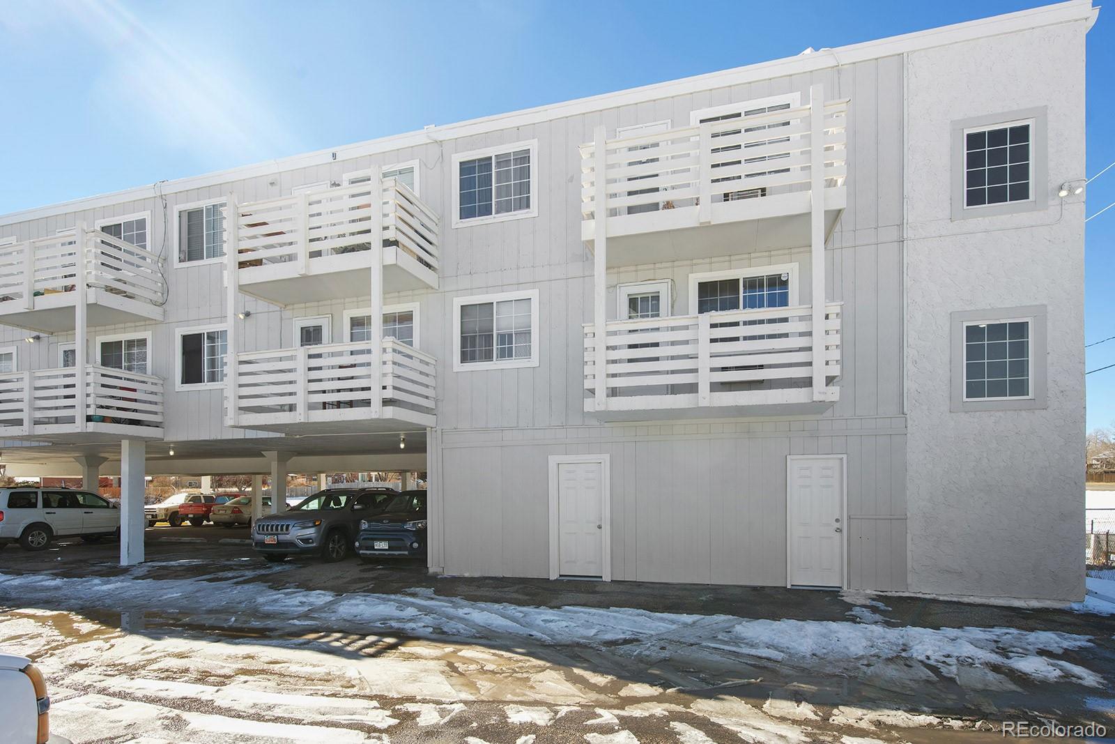 a front view of a building with a yard