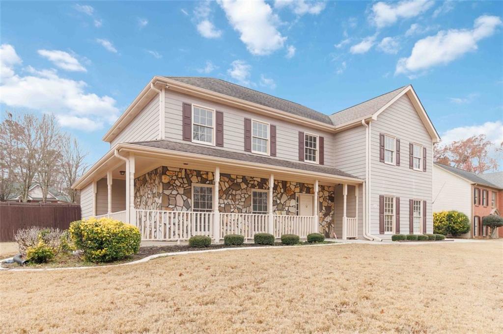 a front view of a house with a yard