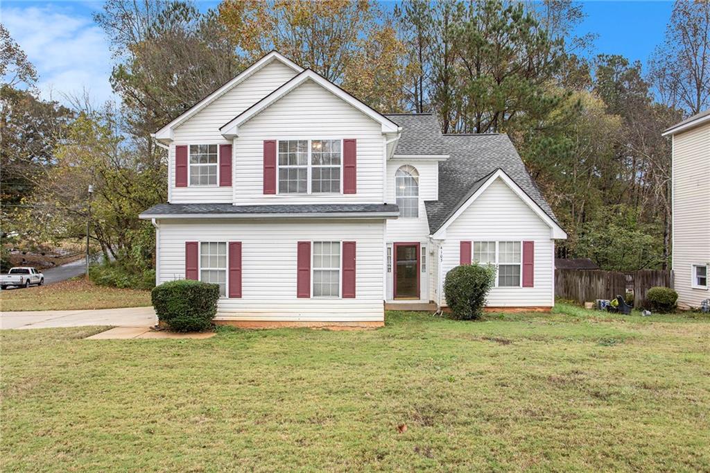 a front view of a house with a yard