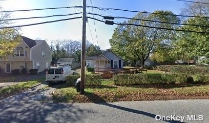 a view of a house with a street