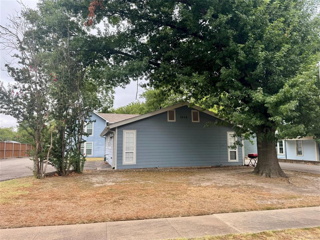 a house with a tree in the background