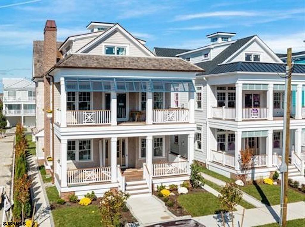 a front view of a house with a yard outdoor seating and barbeque oven