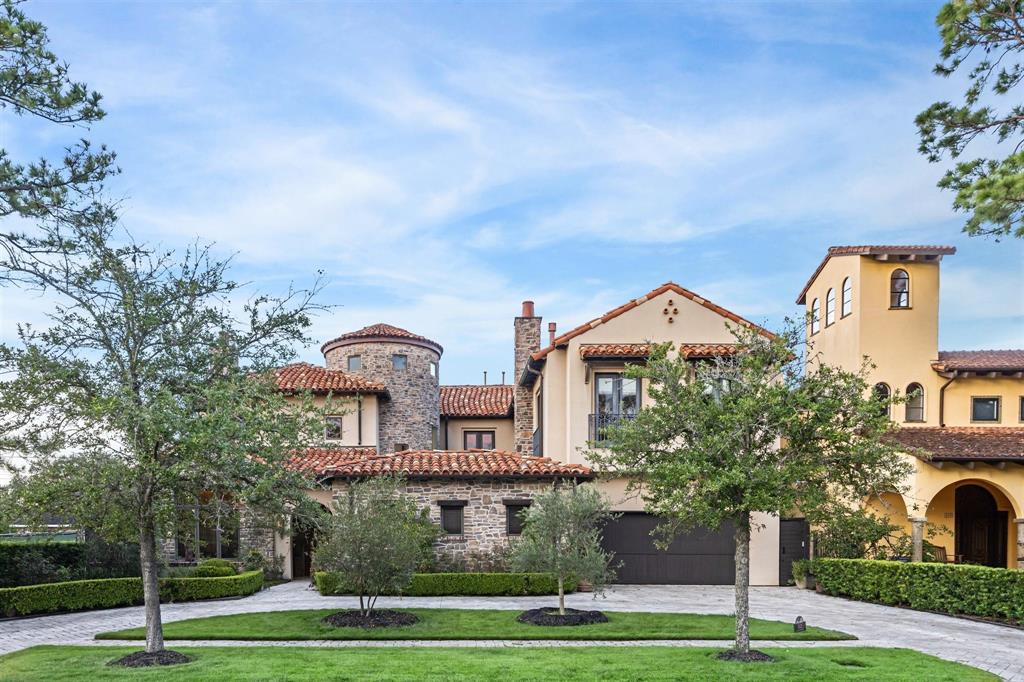 Exquisite Mediterranean style home facing Memorial Park. Lovely tile roof, multiple levels and grand rotunda.