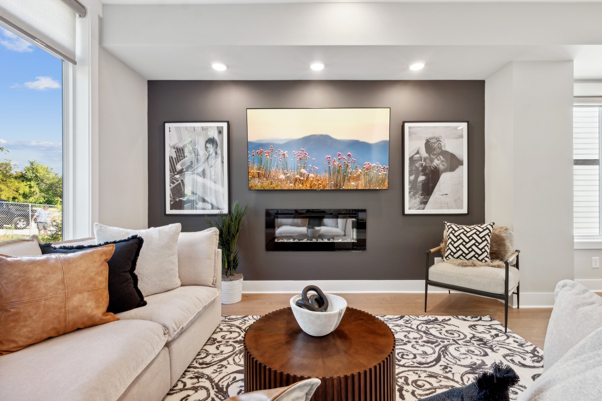 a living room with furniture and a flat screen tv