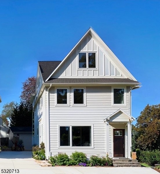 a front view of a house with garage