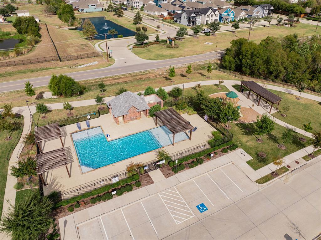 an aerial view of residential houses with outdoor space