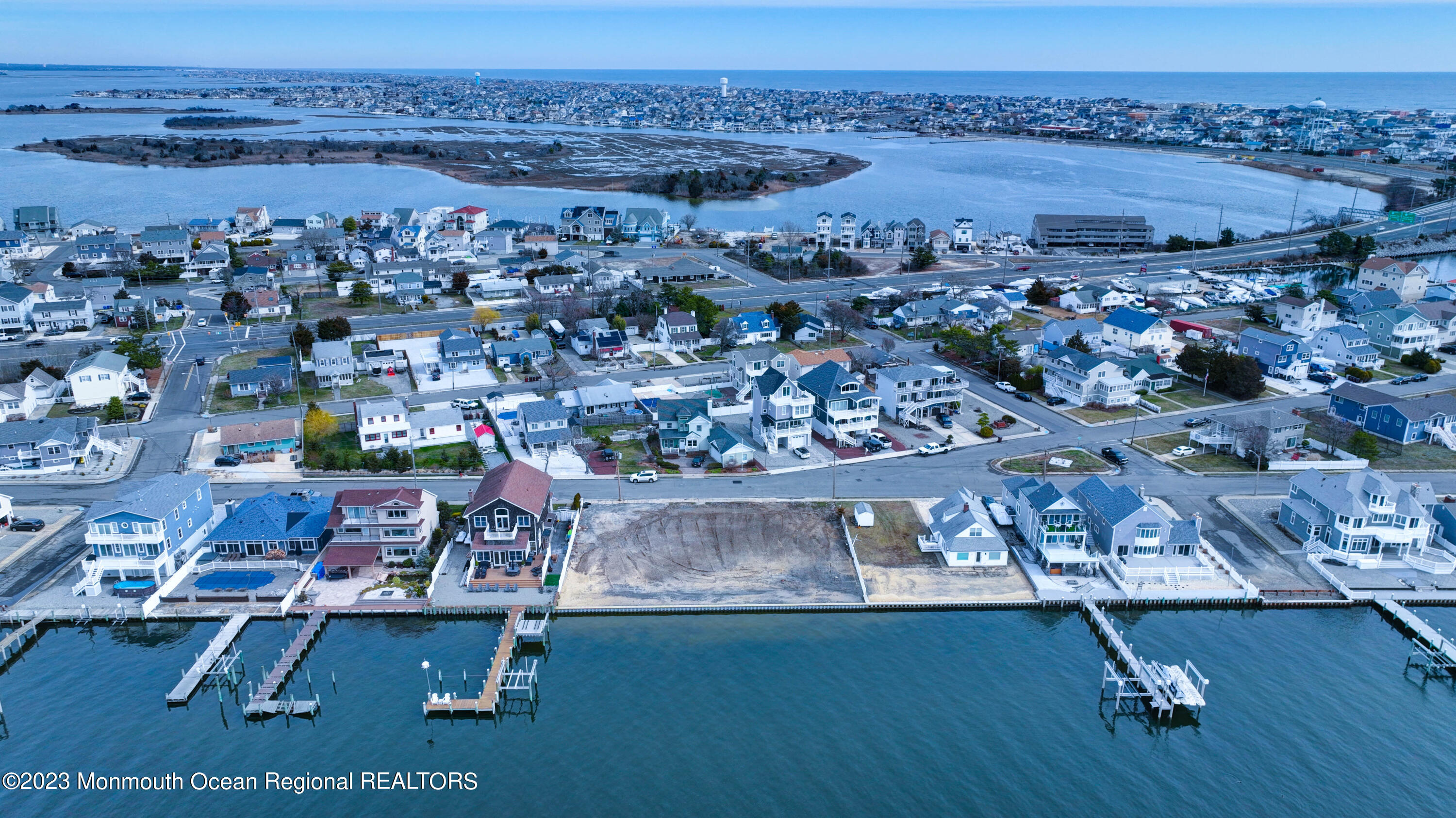 an aerial view of a house with a ocean view