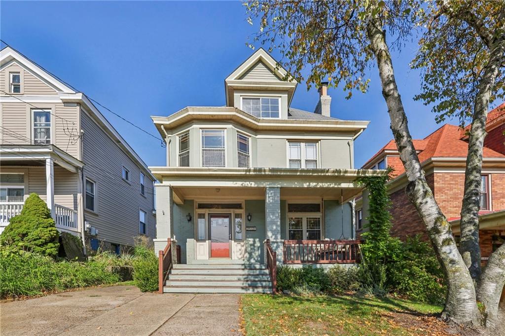 front view of a house with a yard