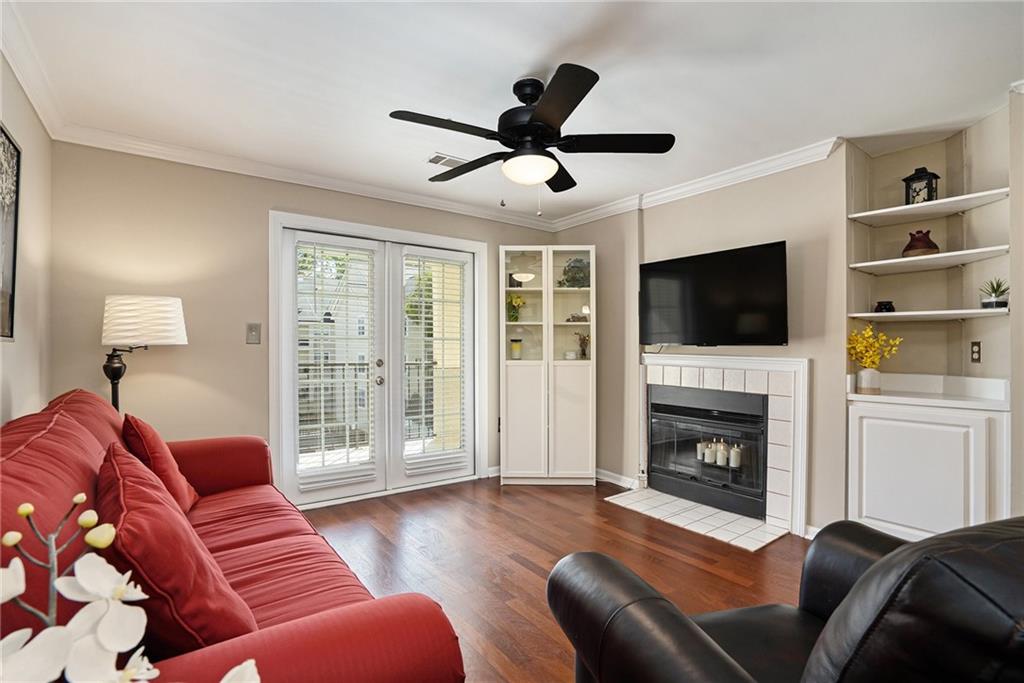 a living room with furniture fireplace and flat screen tv