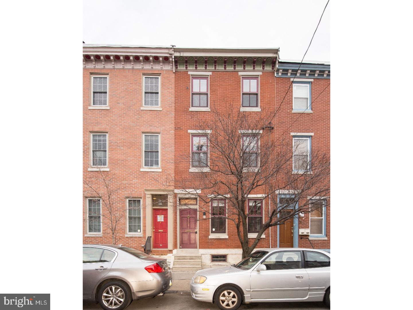 a front view of a house with parking space