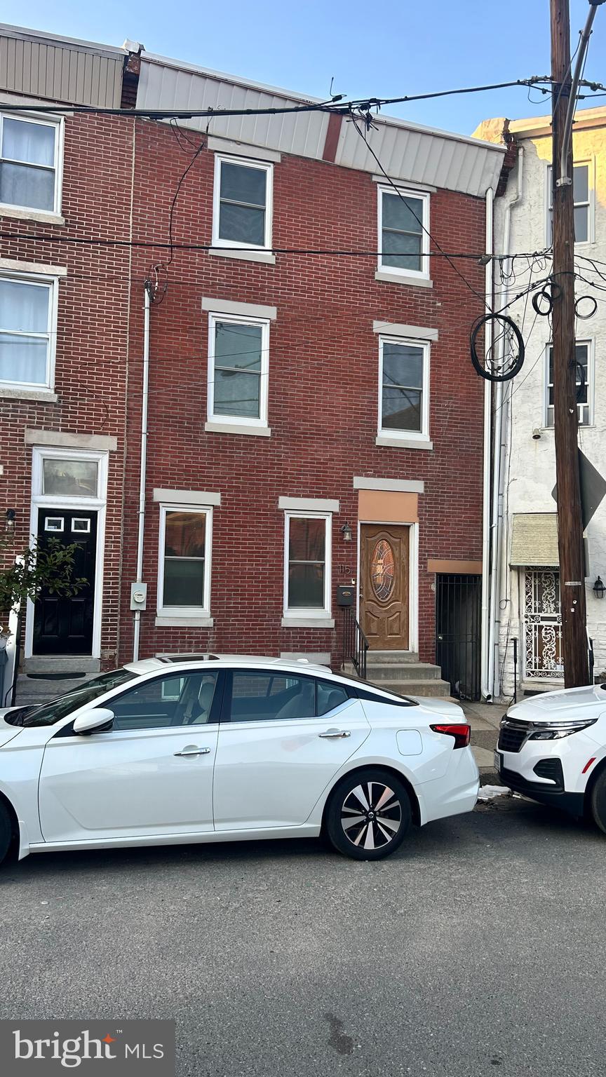 a view of a car parked in front of a building