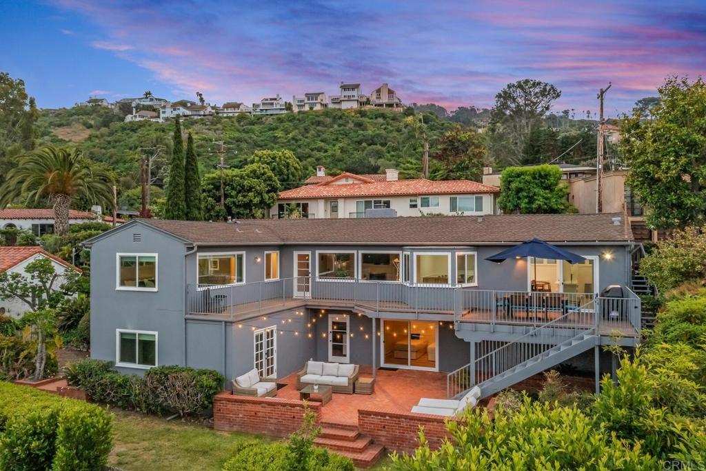 an aerial view of a house with a garden space