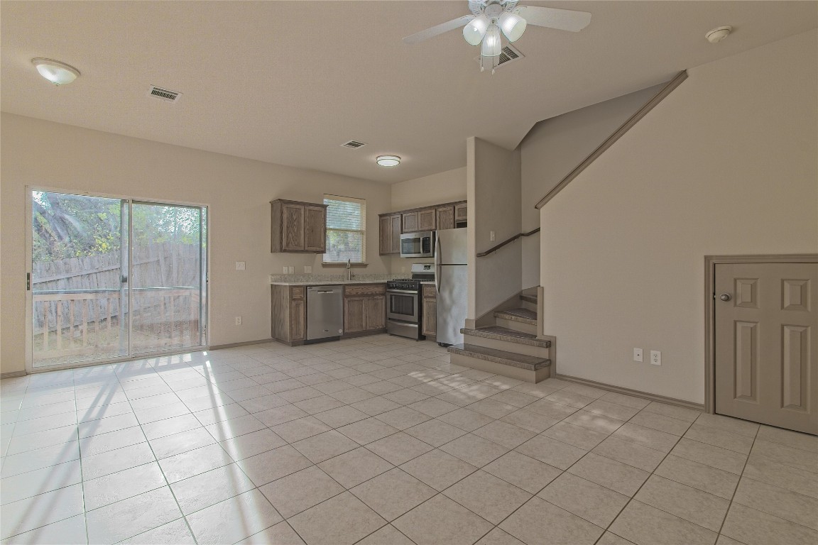 a view of a kitchen with furniture and a kitchen