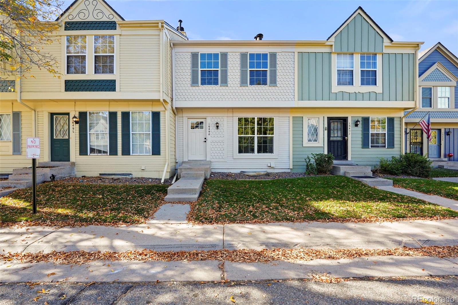 a front view of a house with a yard and porch