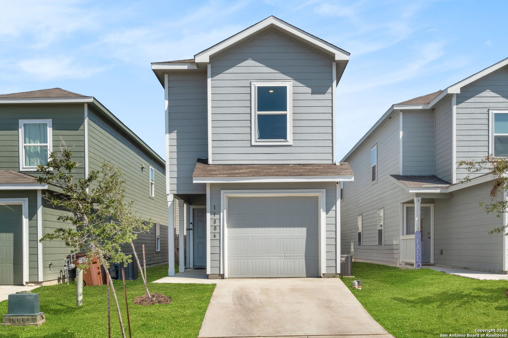 a front view of a house with a yard