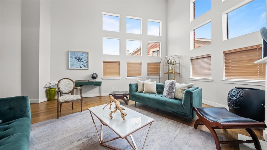 a living room with furniture a table and a window