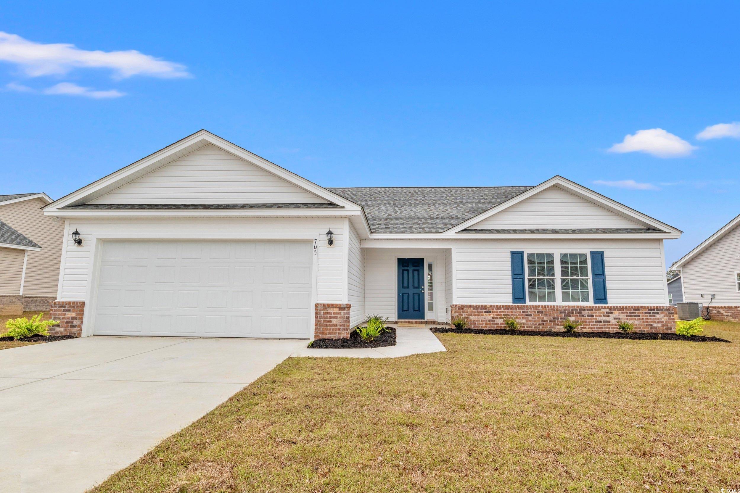 View of front of house featuring a porch, a garage