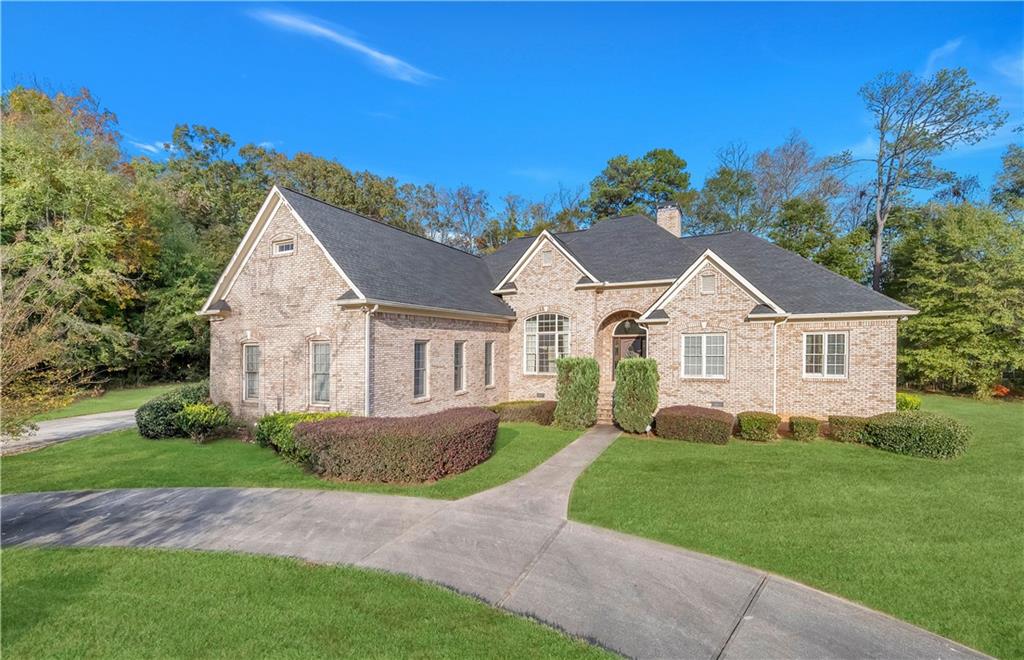 a front view of a house with a yard