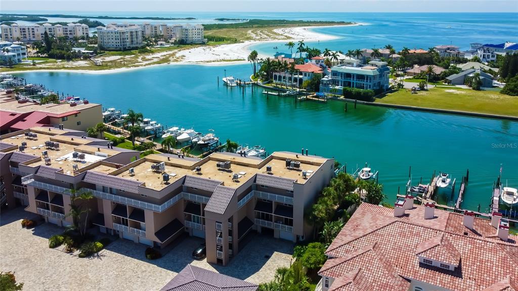 an aerial view of a house with a lake view