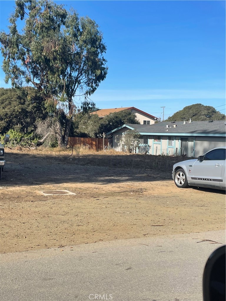 a view of a car parked in front of a house