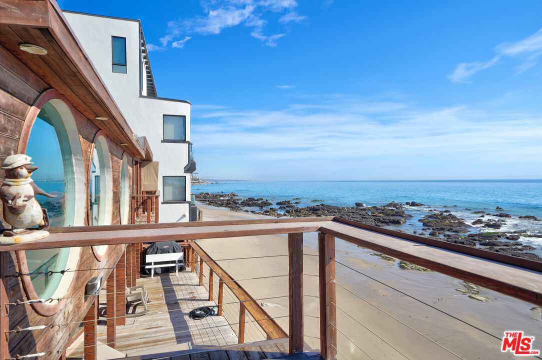 a view of a balcony with an ocean view