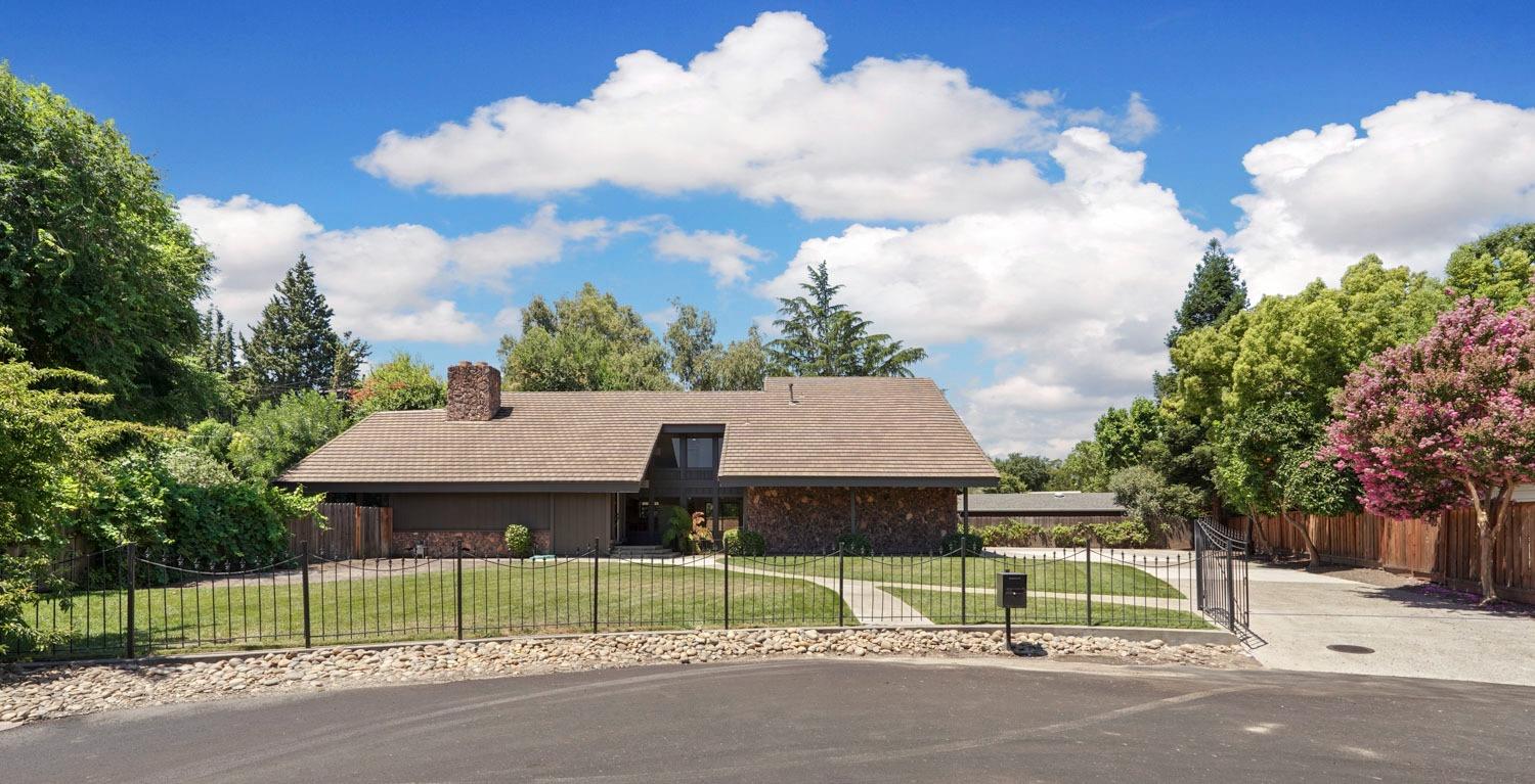 a view of house with backyard and outdoor space