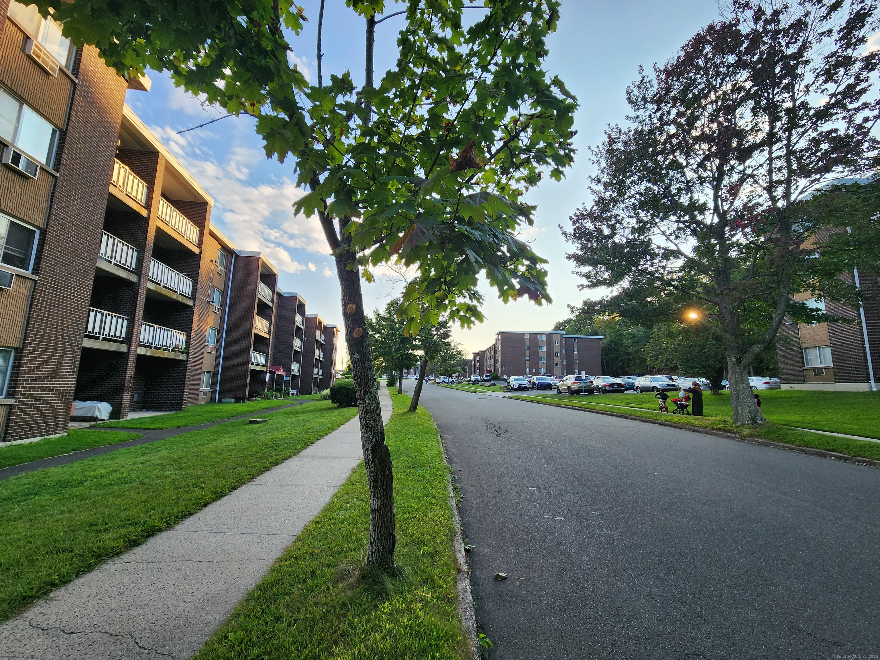 a front view of a building with a yard