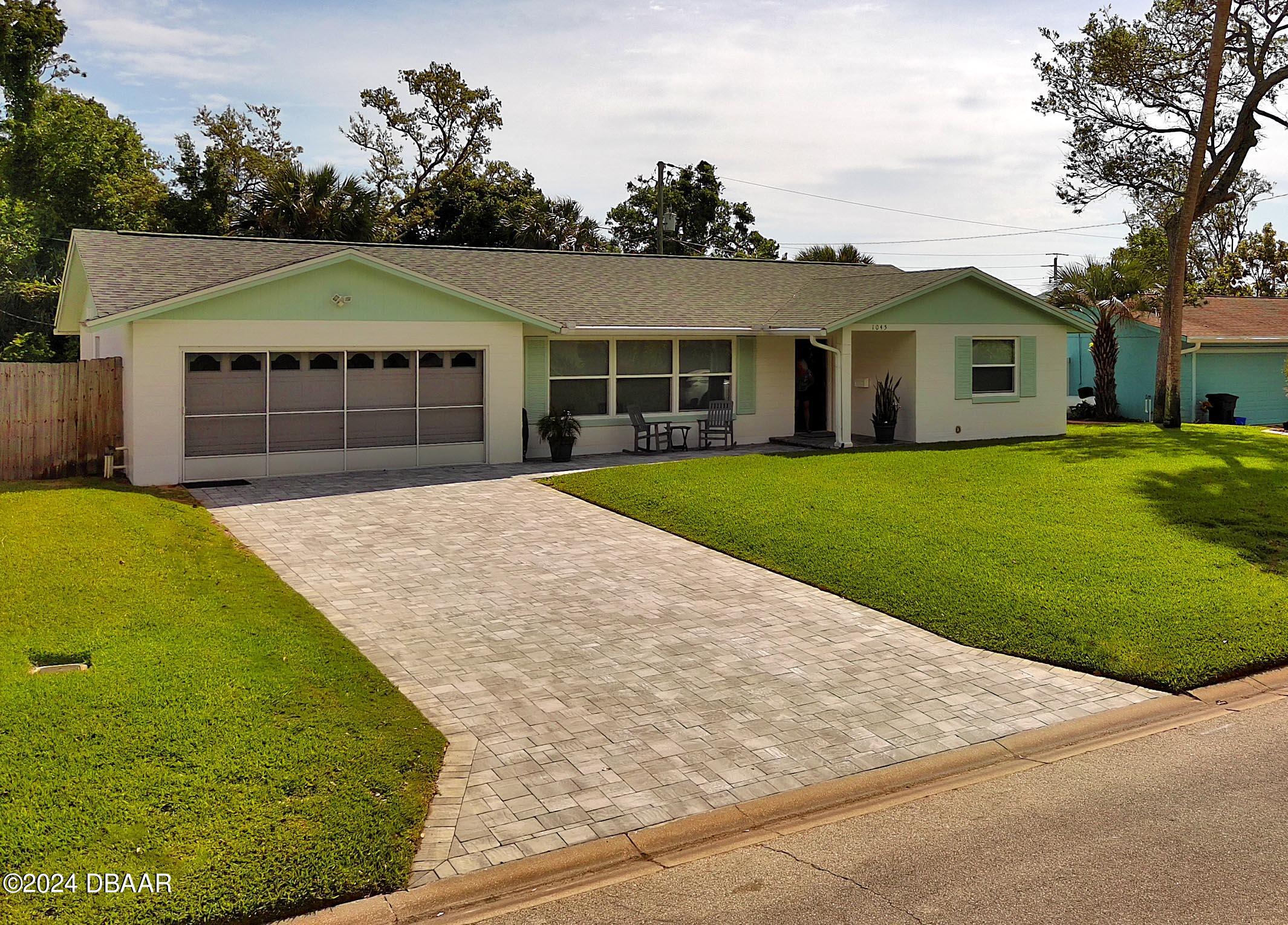 a view of house with yard and entertaining space