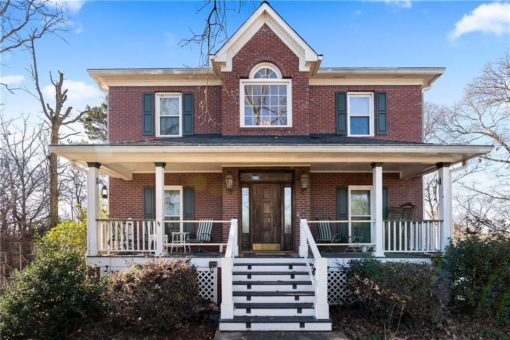 a front view of a house with a porch