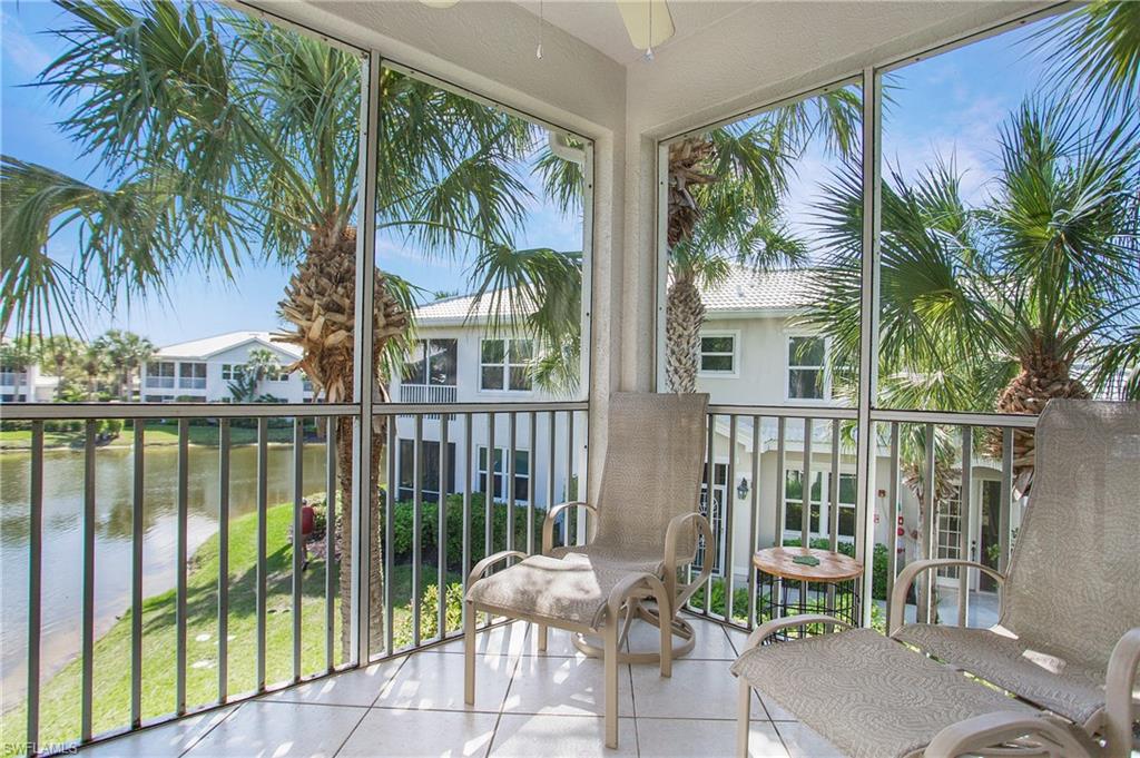 a view of a balcony with lake view and a potted plant