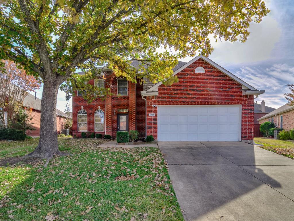 Front of property featuring a garage