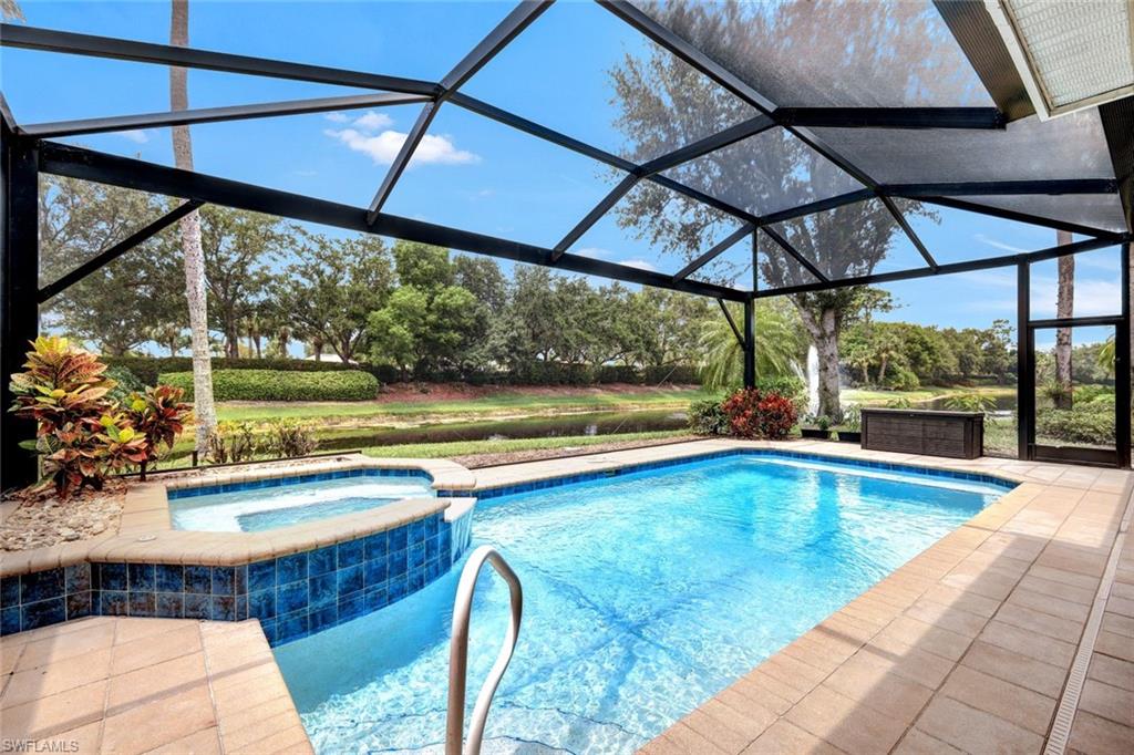 a view of a swimming pool with a yard