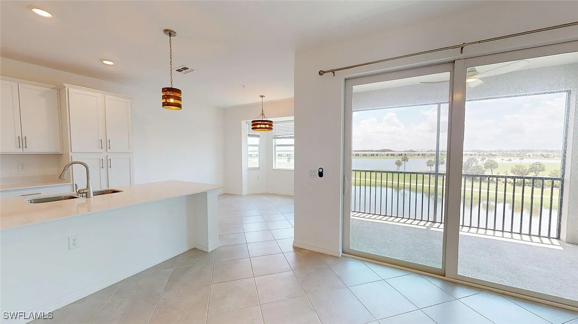 a view of a kitchen with a sink and dishwasher