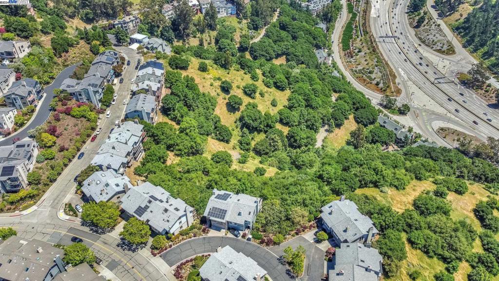 an aerial view of a house with lots of trees