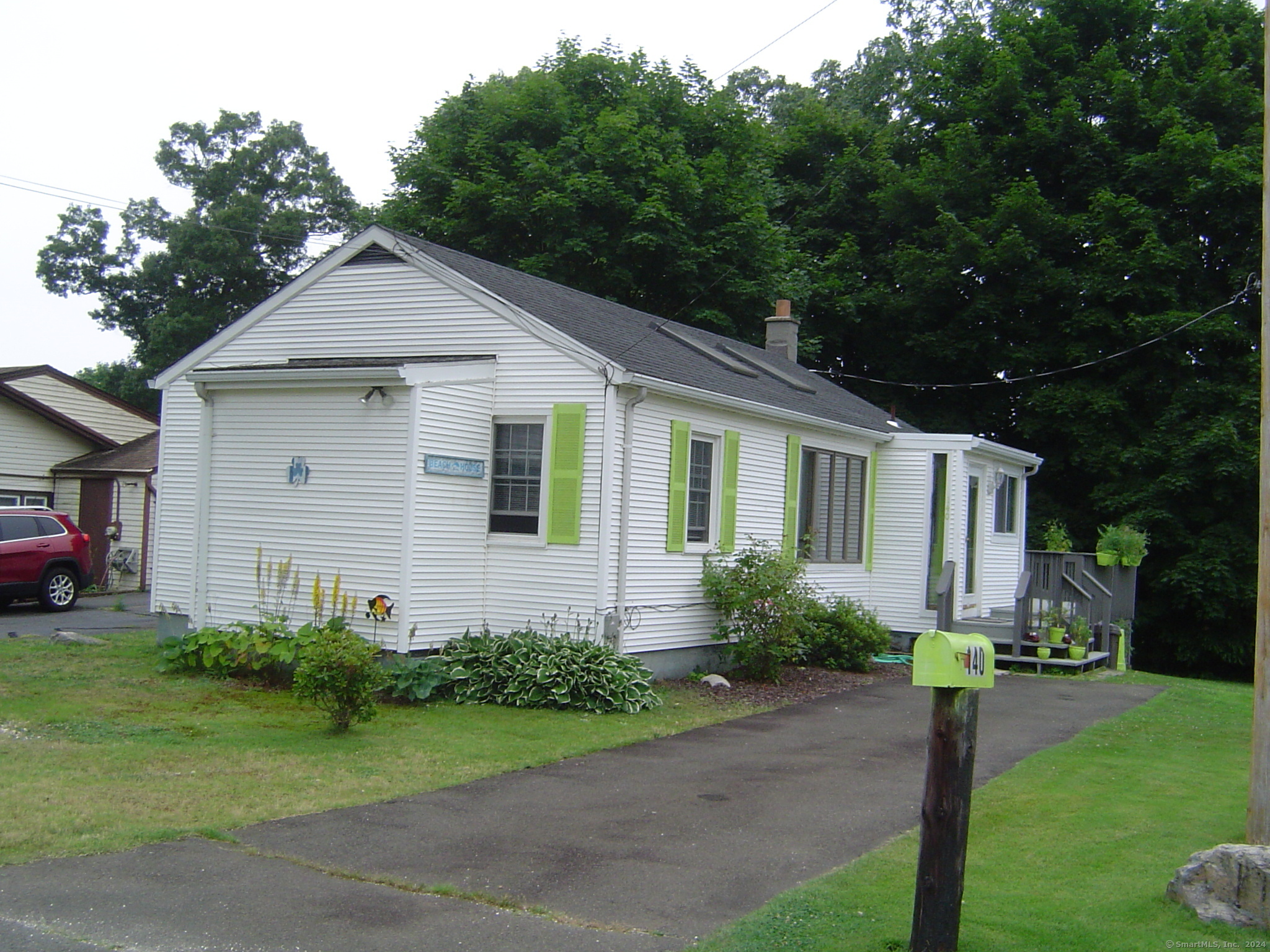 a front view of house with yard and green space