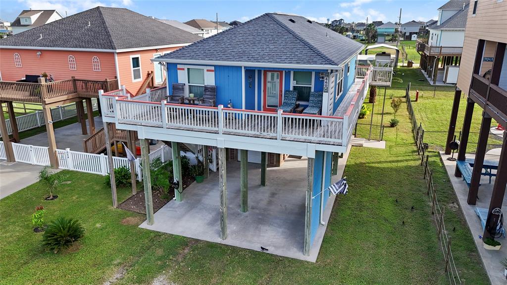 an aerial view of a house with swimming pool garden and patio