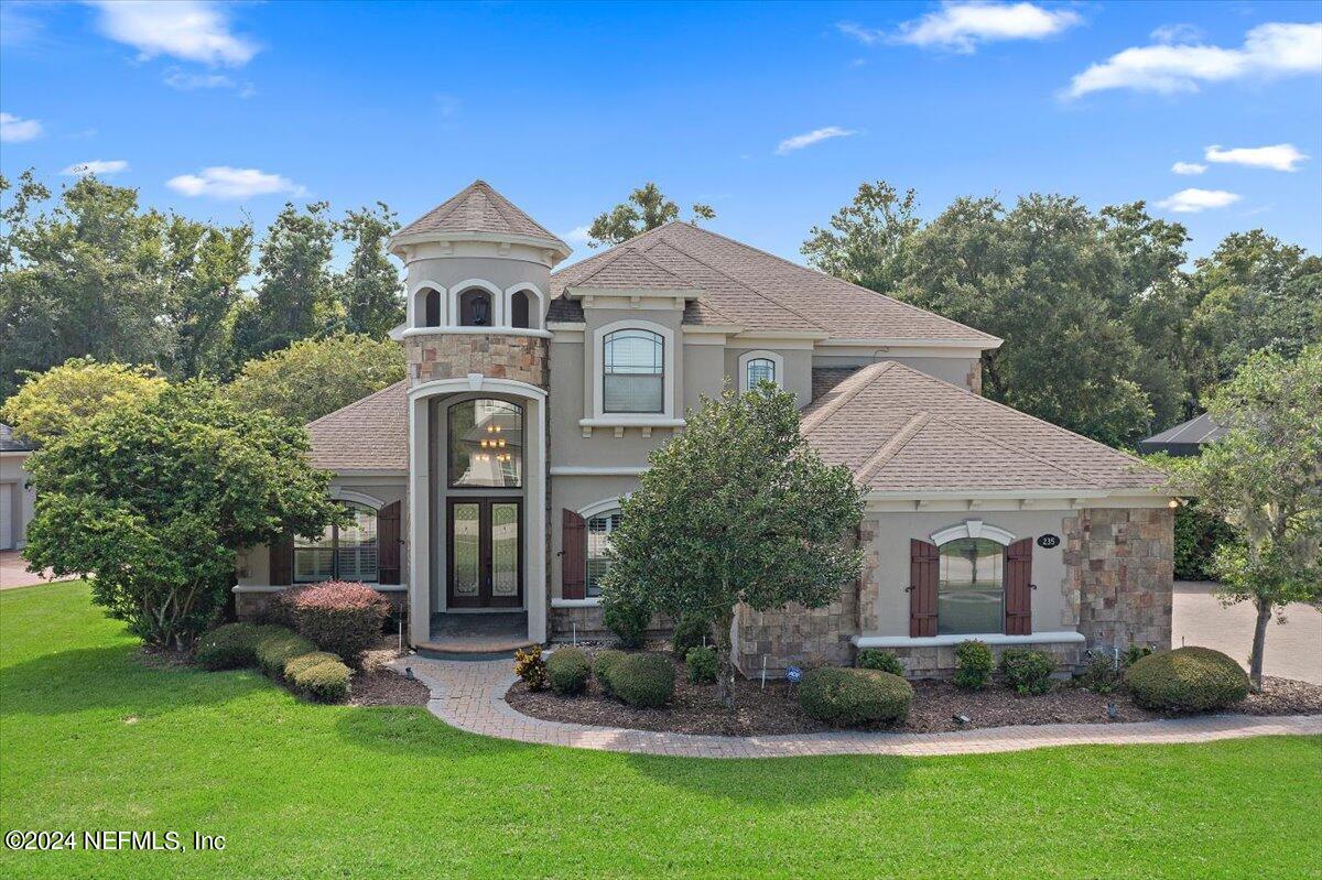 a front view of a house with garden