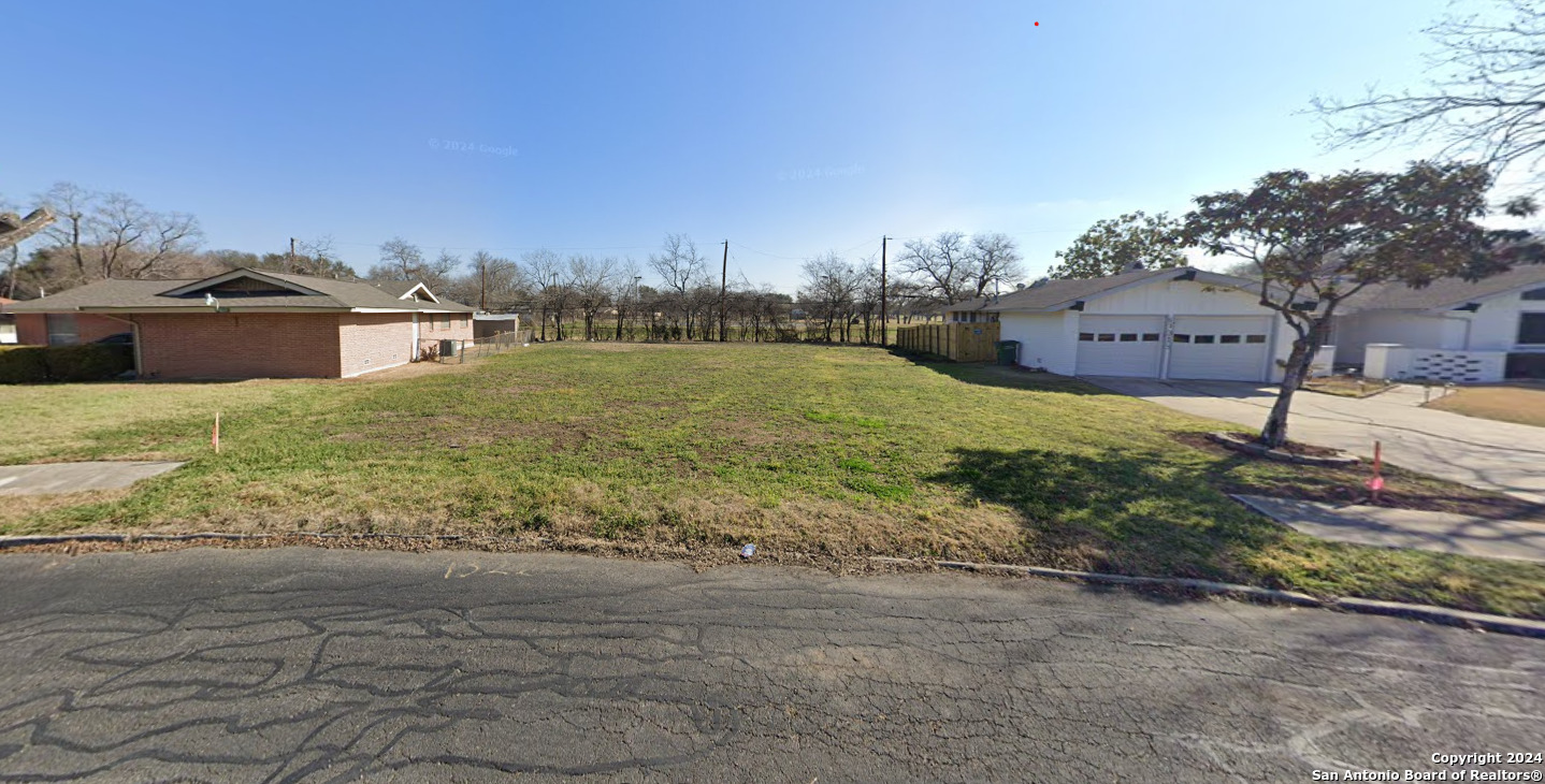 a view of a big yard next to a building