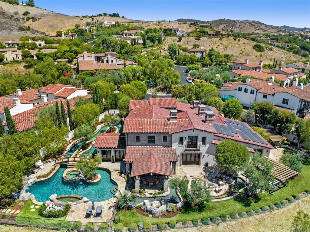 an aerial view of house with yard